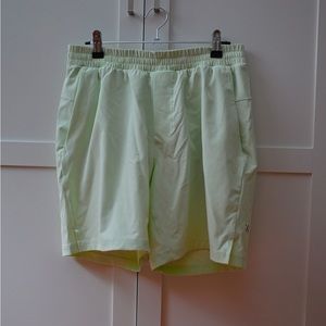 Lululemon men’s swim short in faint neon yellow.